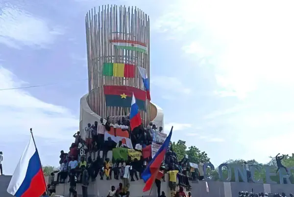 Supporters of Niger’s junta hold Russian flag during a demonstration