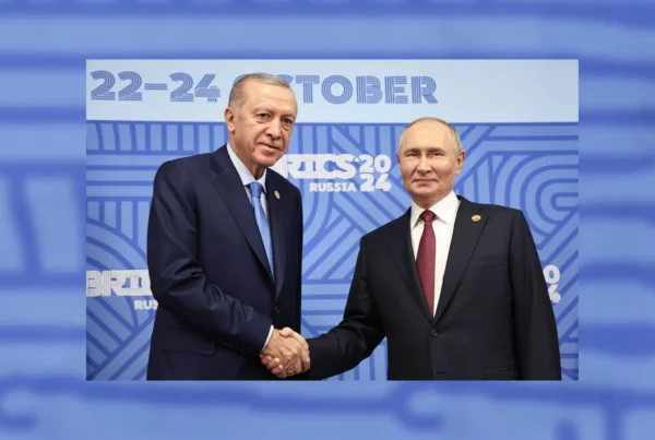 Erdogan and Putin shake hands as they pose for photos before a meeting on the sidelines of the 16th BRICS Summit